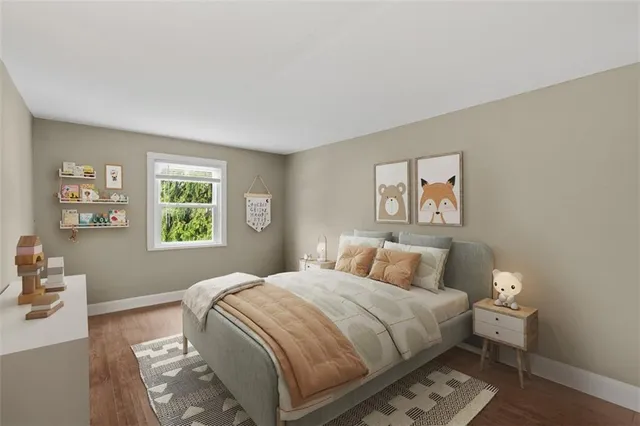 an empty room with wooden floor & windows