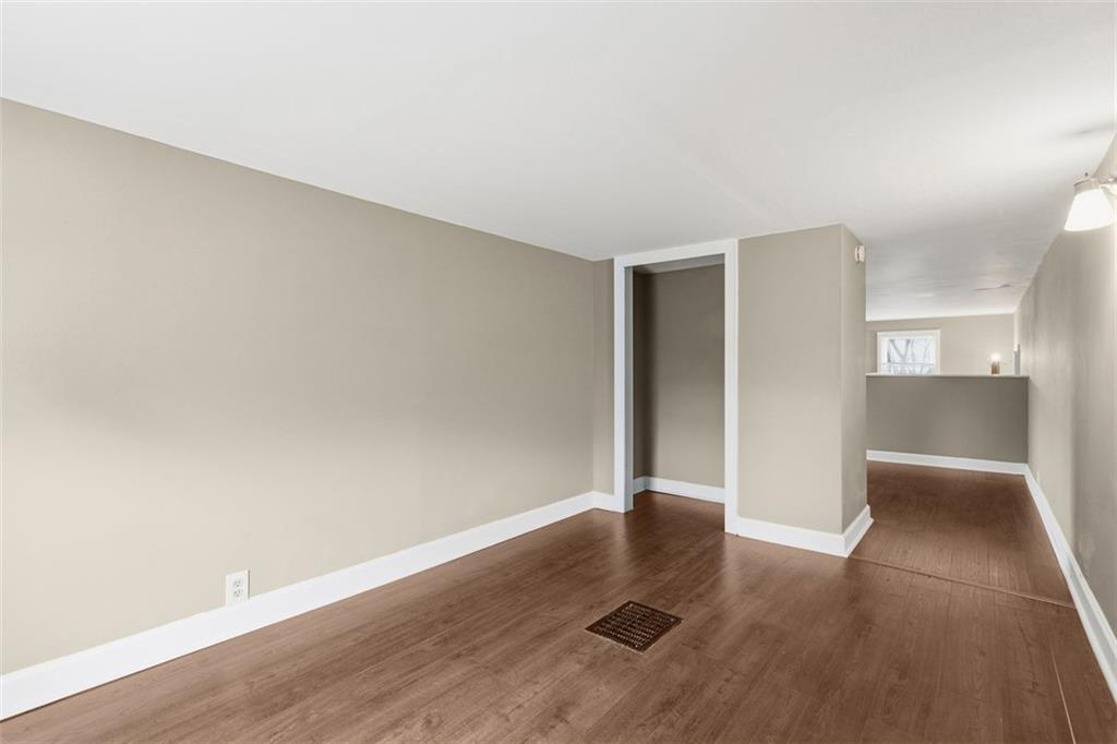 2609 Lah Road Gibsonia, PA 15044 - Photo 34 of 48 an empty room with wooden floor & windows