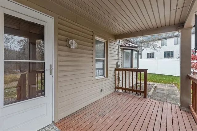 a view of a house with wooden deck