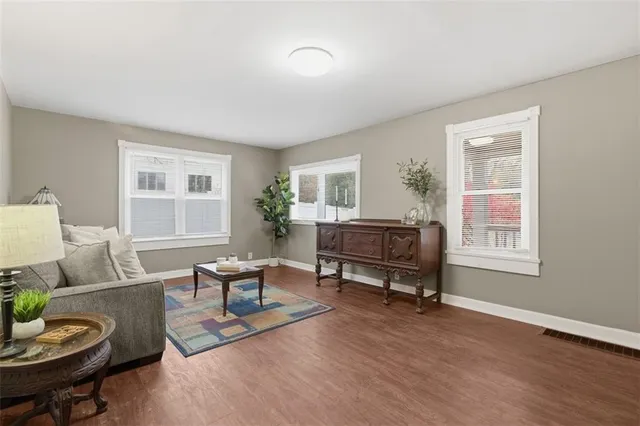 a living room with furniture and a table