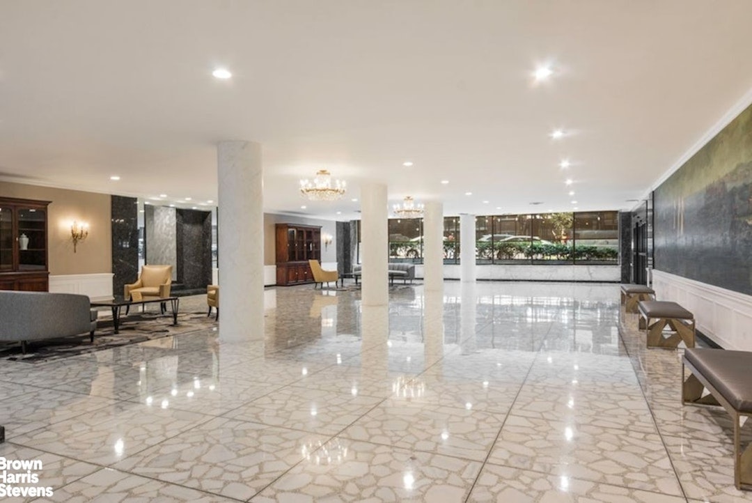 370 East 76th Street, Unit A1002 Manhattan, NY 10021 - Photo 11 of 13 a lobby with entryway and a potted plant