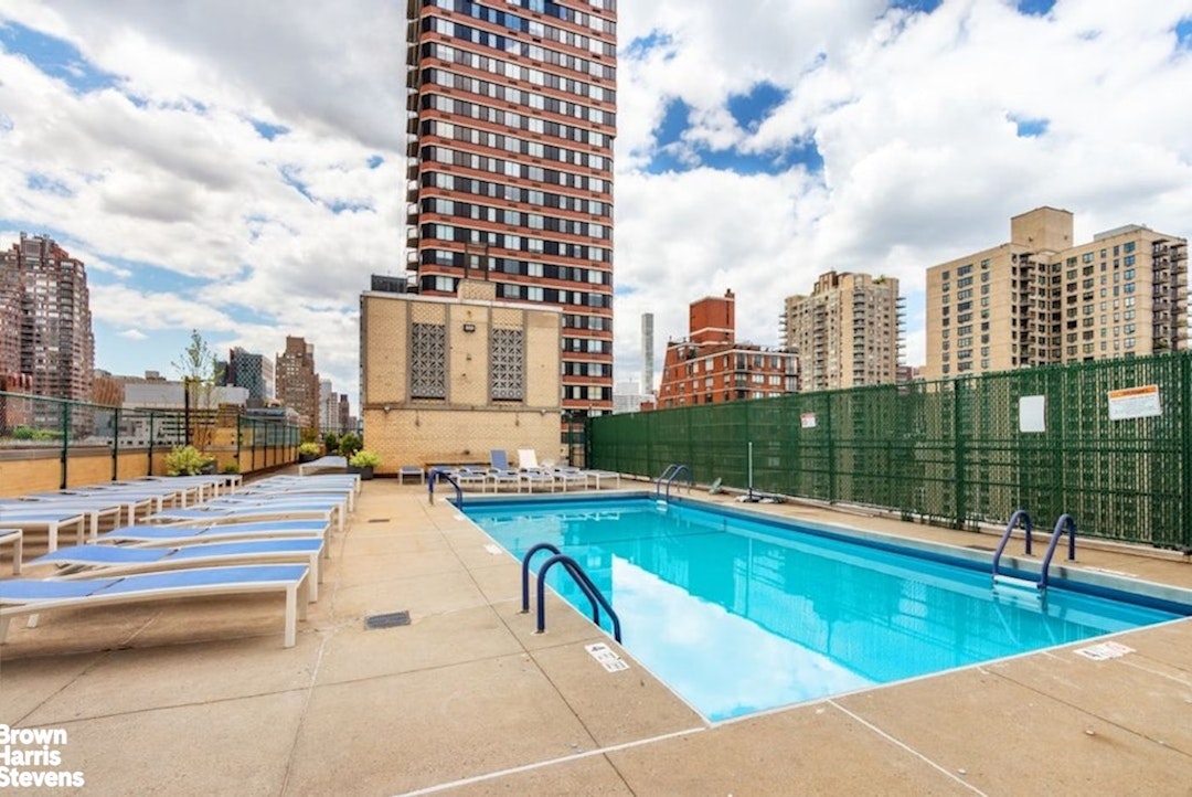 370 East 76th Street, Unit A1002 Manhattan, NY 10021 - Photo 12 of 13 a view of balcony with couch