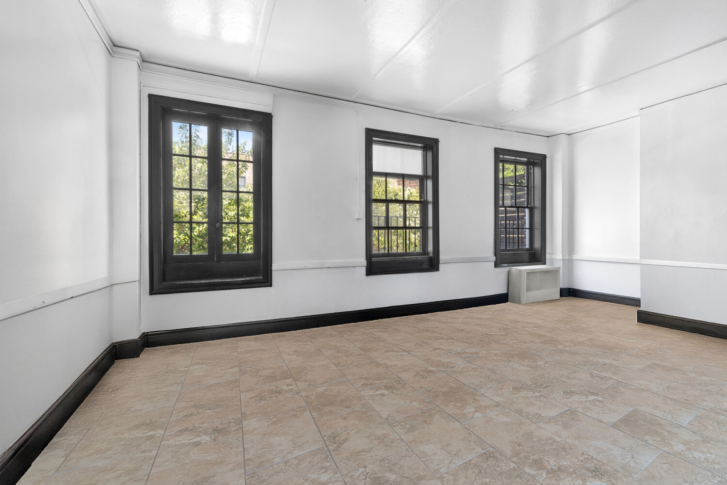 44 Barrow Street Manhattan, NY 10014 - Photo 4 of 10 an empty room with windows