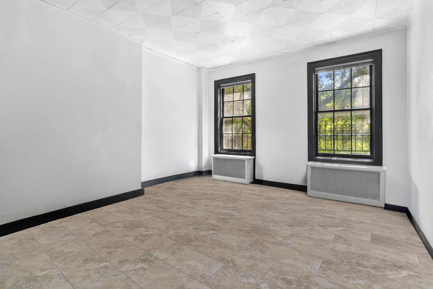 44 Barrow Street Manhattan, NY 10014 - Photo 5 of 10 an empty room with windows