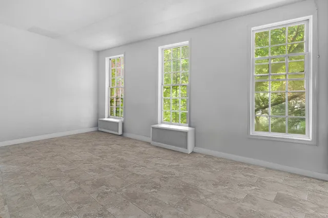 an empty room with windows