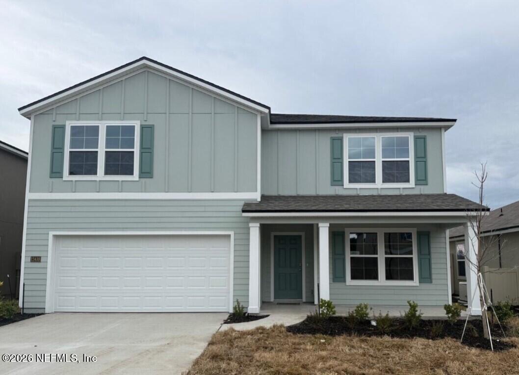 a front view of a house with a garage