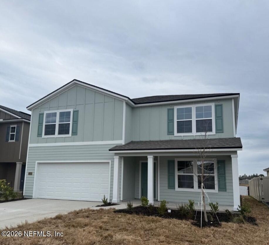 12438 Russian Olive Road Jacksonville, FL 32218 - Photo 3 of 66 a front view of a house with garage