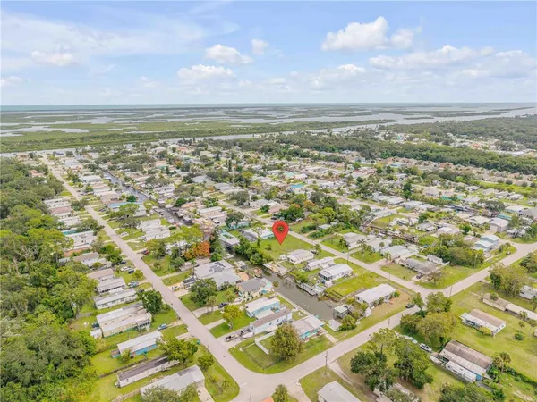 an aerial view of residential building and lake