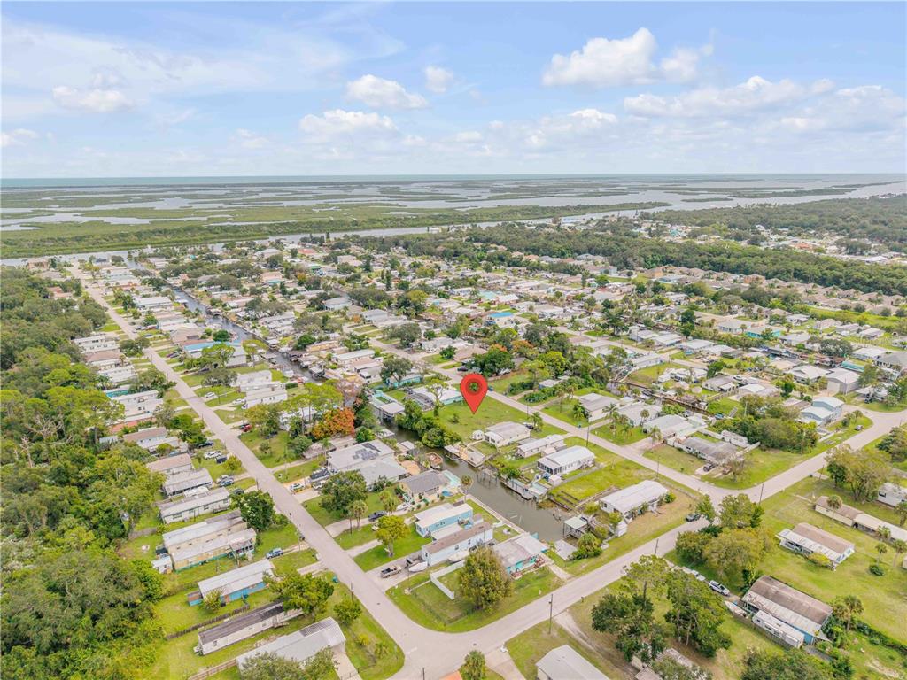 113 Charles Street Edgewater, FL 32141 - Photo 4 of 23 an aerial view of residential building and lake