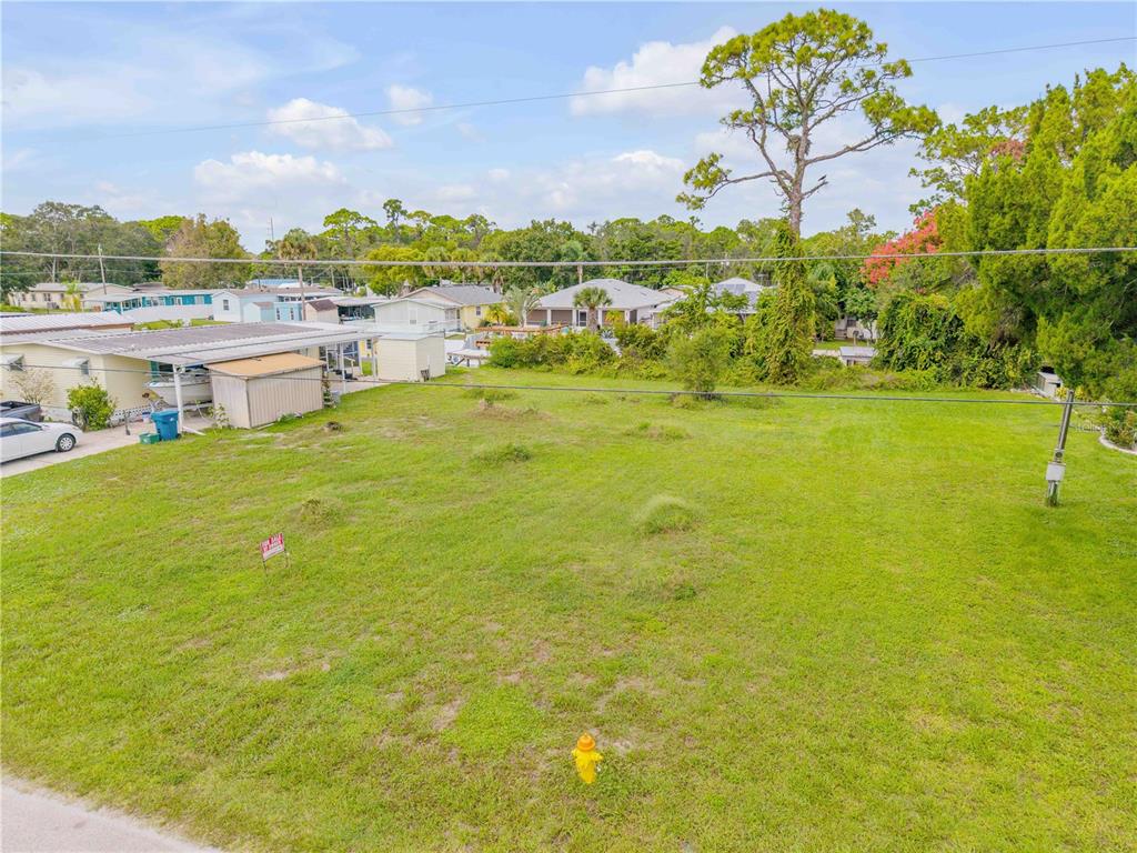 113 Charles Street Edgewater, FL 32141 - Photo 6 of 23 a view of a lake with houses