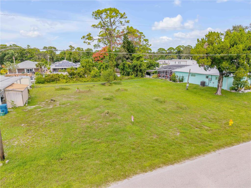 113 Charles Street Edgewater, FL 32141 - Photo 7 of 23 a view of a lake with a houses
