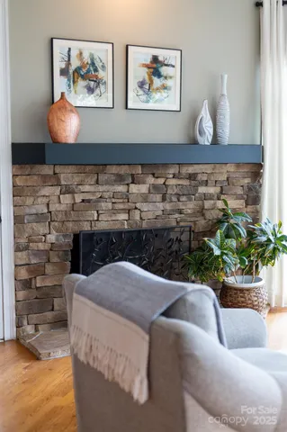 a living room with furniture and flowers