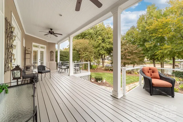 a view of a balcony with couch and wooden floor