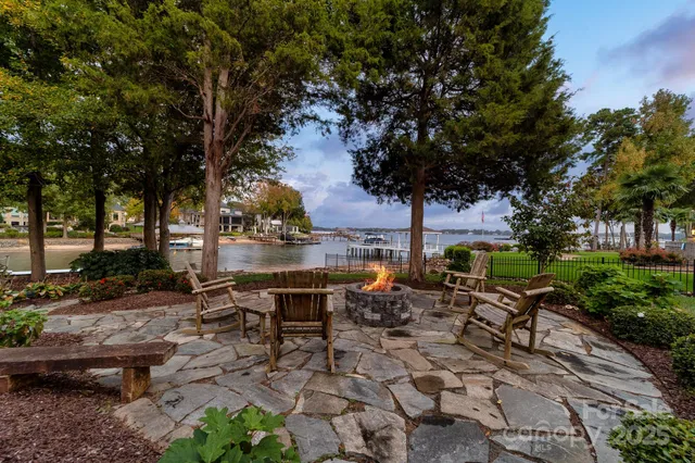 a view of a backyard with sitting area