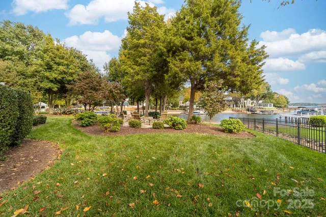 a view of yard with swimming pool and green space