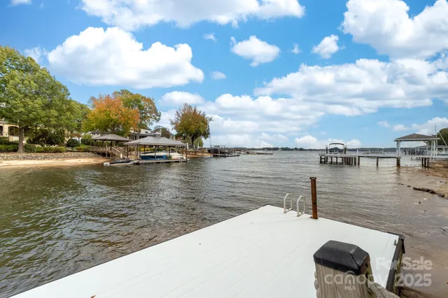 a bedroom with a bed a couch and dresser