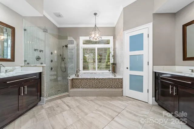 a bathroom with a toilet sink and shower