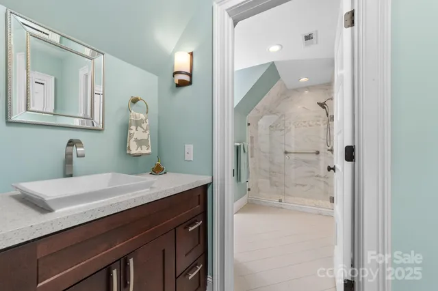 a bedroom with a bed and a dresser in it