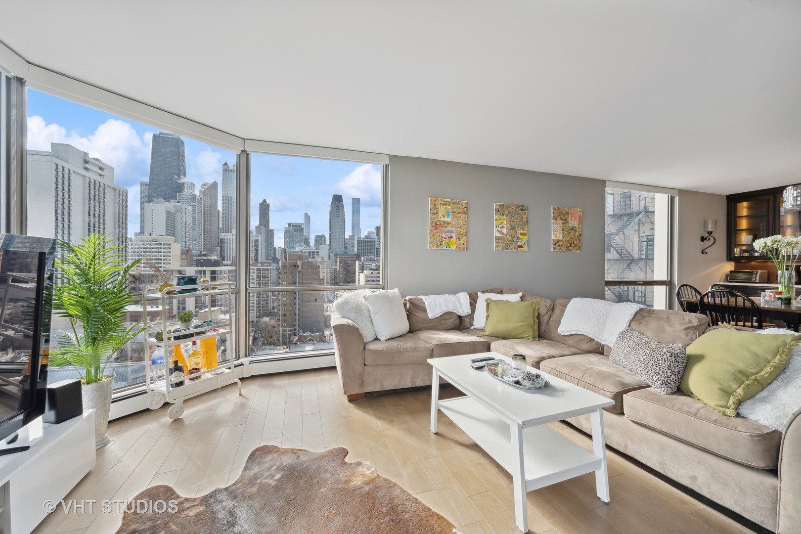 1310 North Ritchie Court, Unit 19C Chicago, IL 60610 - Photo 5 of 10 a living room with furniture and a flat screen tv
