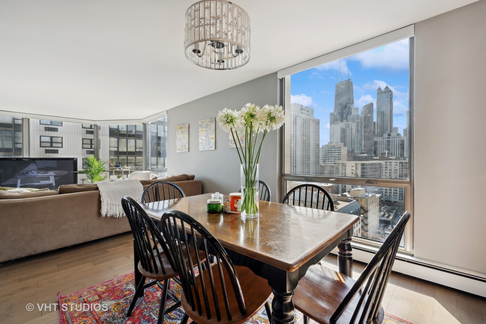 1310 North Ritchie Court, Unit 19C Chicago, IL 60610 - Photo 7 of 10 a view of a dining room with furniture and chandelier