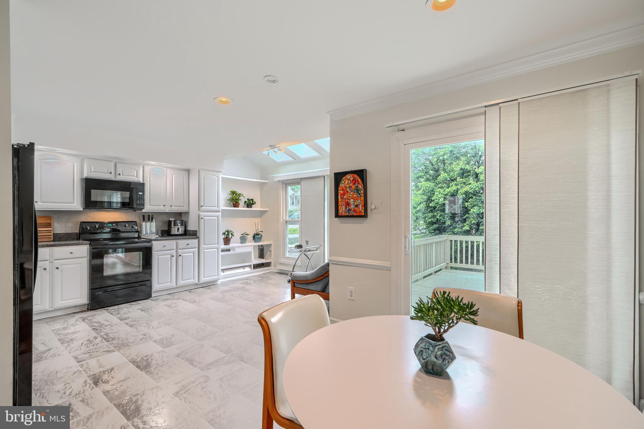 1 Second Tee Court Baltimore, MD 21209 - Photo 12 of 41 a living room with furniture and a kitchen area