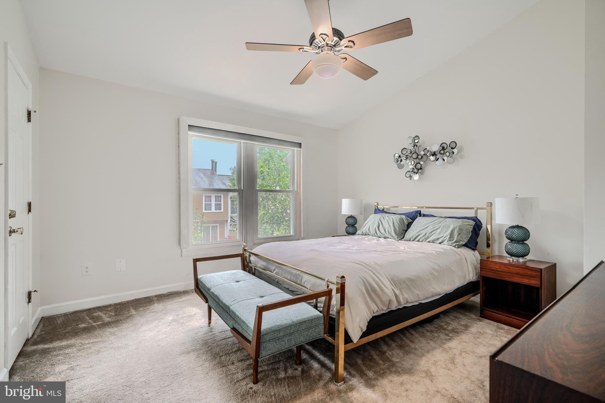 1 Second Tee Court Baltimore, MD 21209 - Photo 17 of 41 a bedroom with a bed table and window