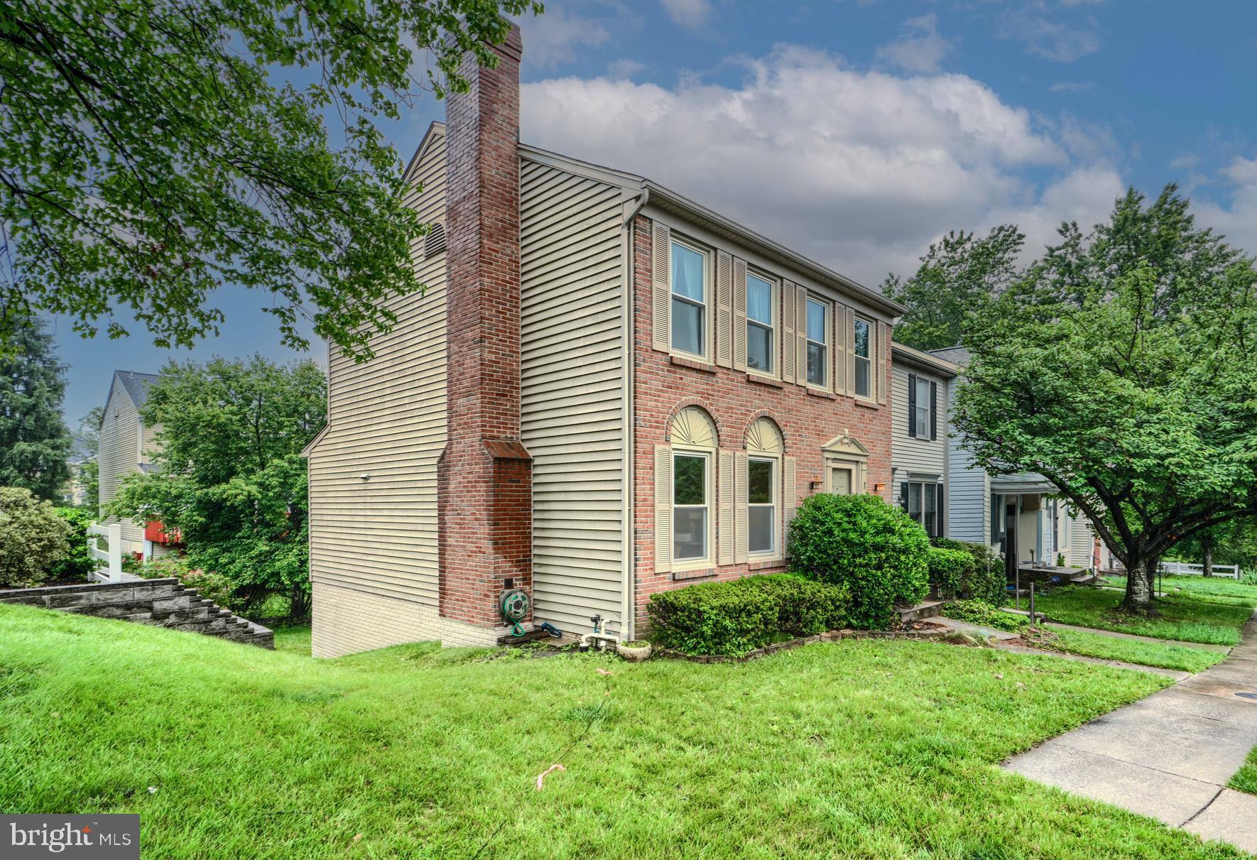1 Second Tee Court Baltimore, MD 21209 - Photo 2 of 41 a front view of a house with a yard