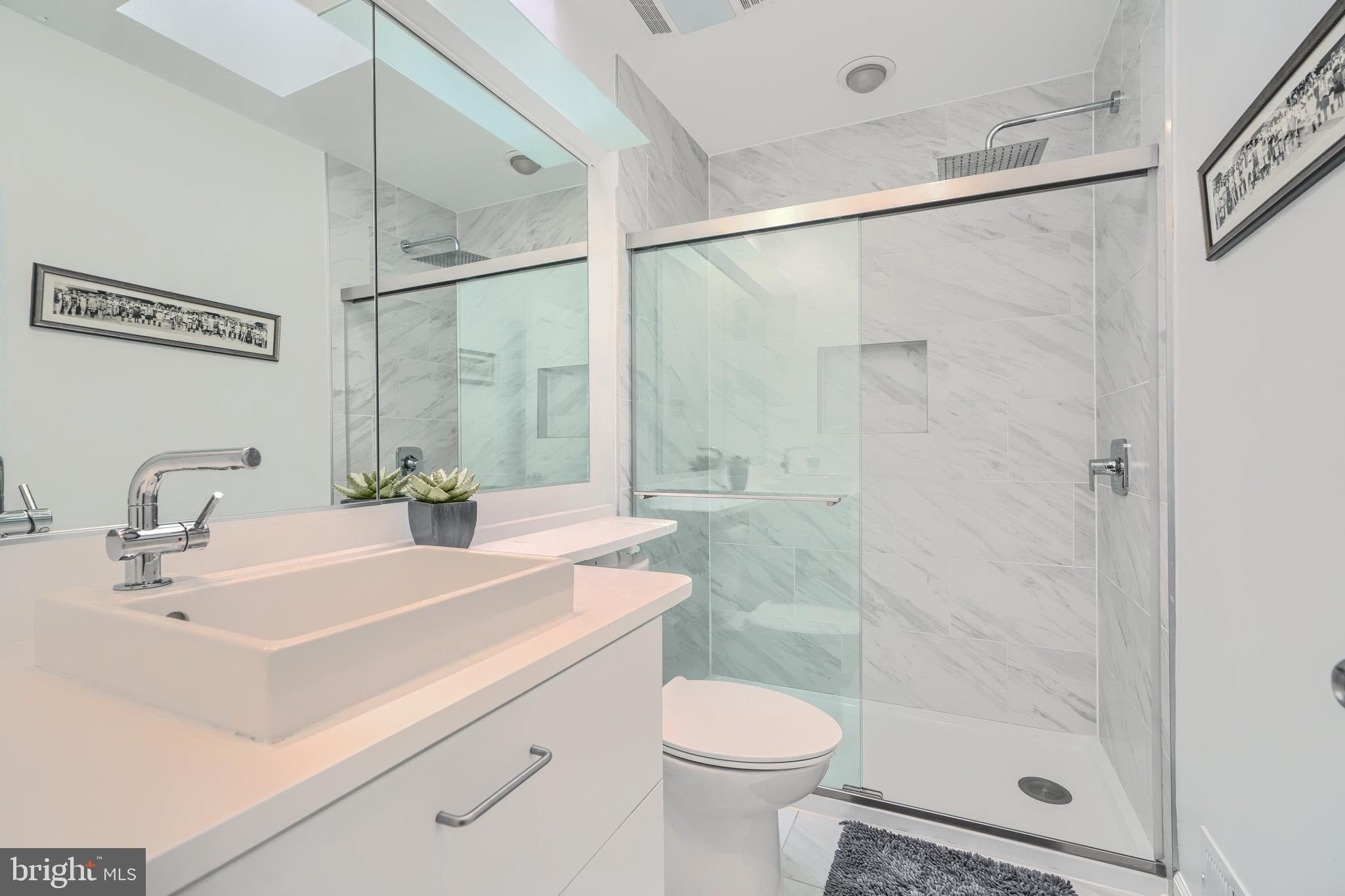 1 Second Tee Court Baltimore, MD 21209 - Photo 22 of 41 a bathroom with a sink toilet and shower