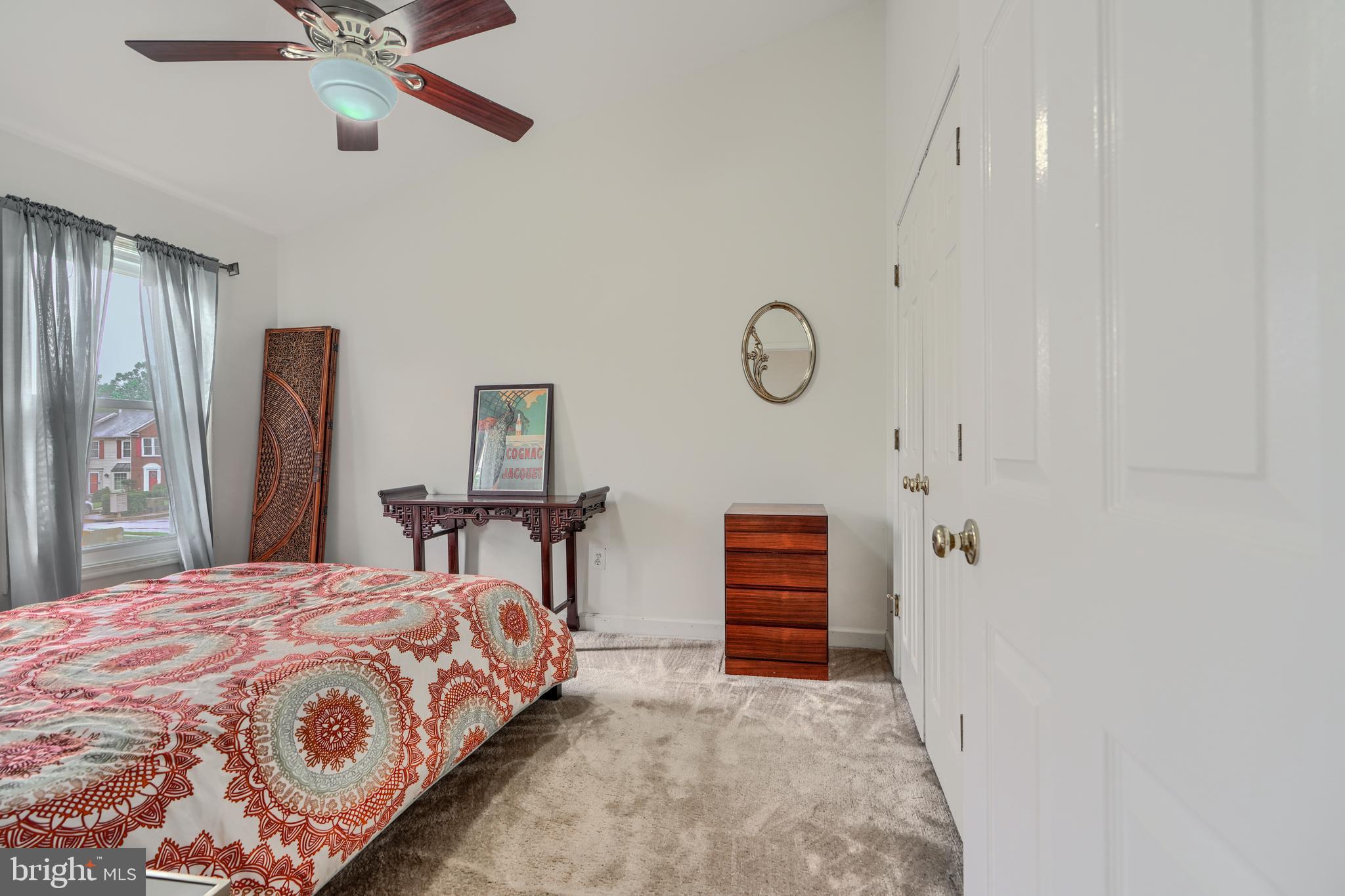 1 Second Tee Court Baltimore, MD 21209 - Photo 24 of 41 a bedroom with a bed and a chandelier