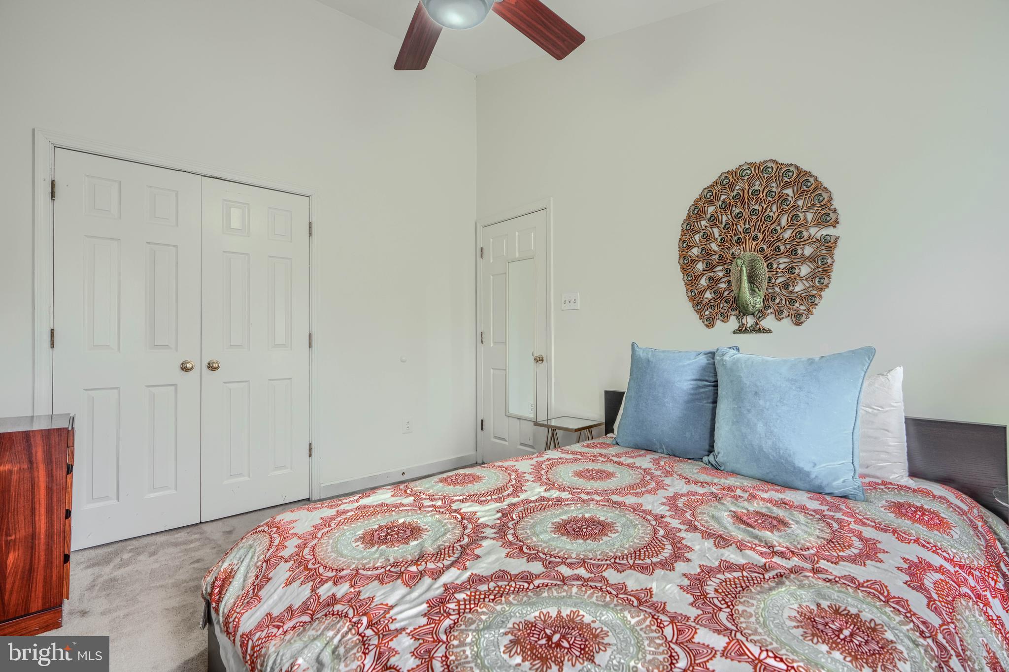 1 Second Tee Court Baltimore, MD 21209 - Photo 25 of 41 a bedroom with a bed and a chandelier