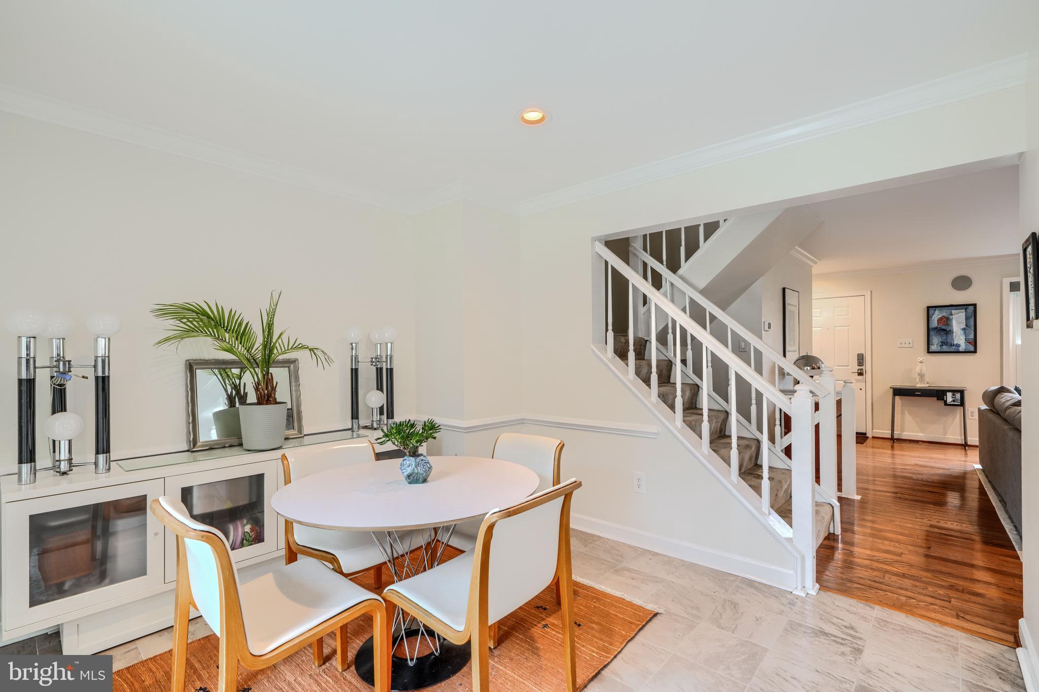 1 Second Tee Court Baltimore, MD 21209 - Photo 10 of 41 a view of a dining room with furniture and wooden floor