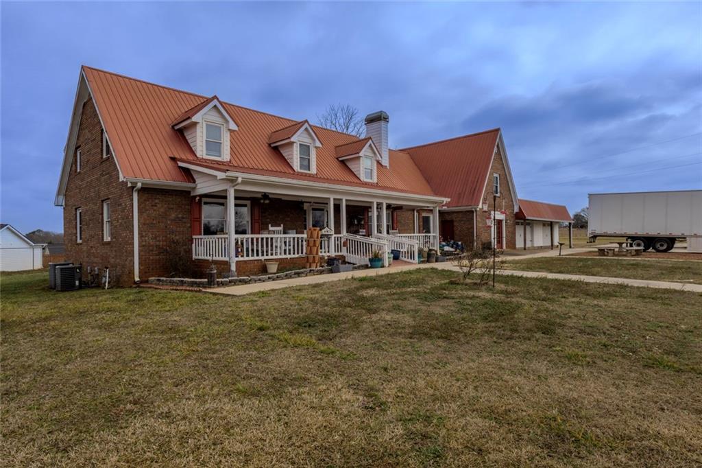 160 Highway 320 Carnesville, GA 30521 - Photo 51 of 68 a view of a big house with a big yard and large trees