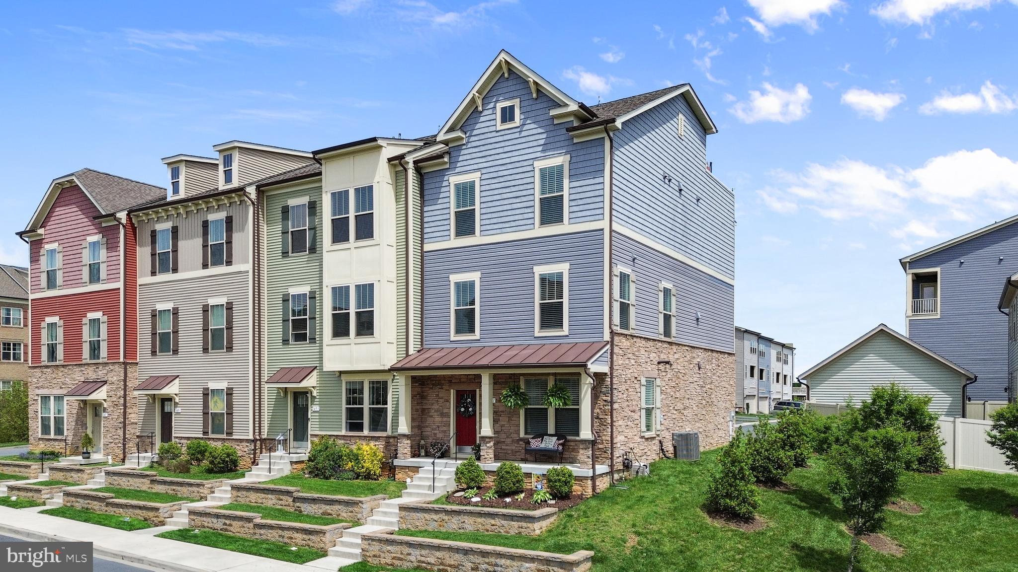 a front view of a residential apartment building with a yard