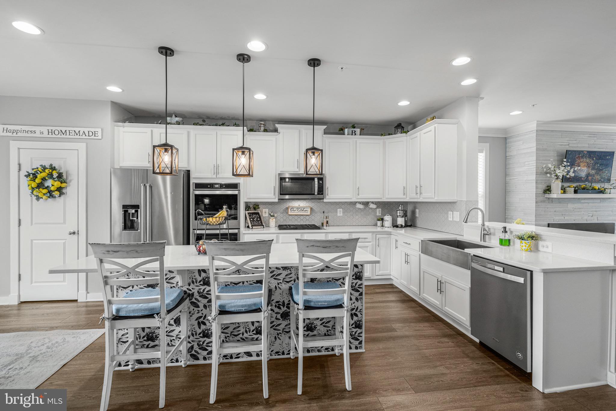 3451 Flatwoods Drive Frederick, MD 21704 - Photo 12 of 43 a large kitchen with lots of counter space and stainless steel appliances
