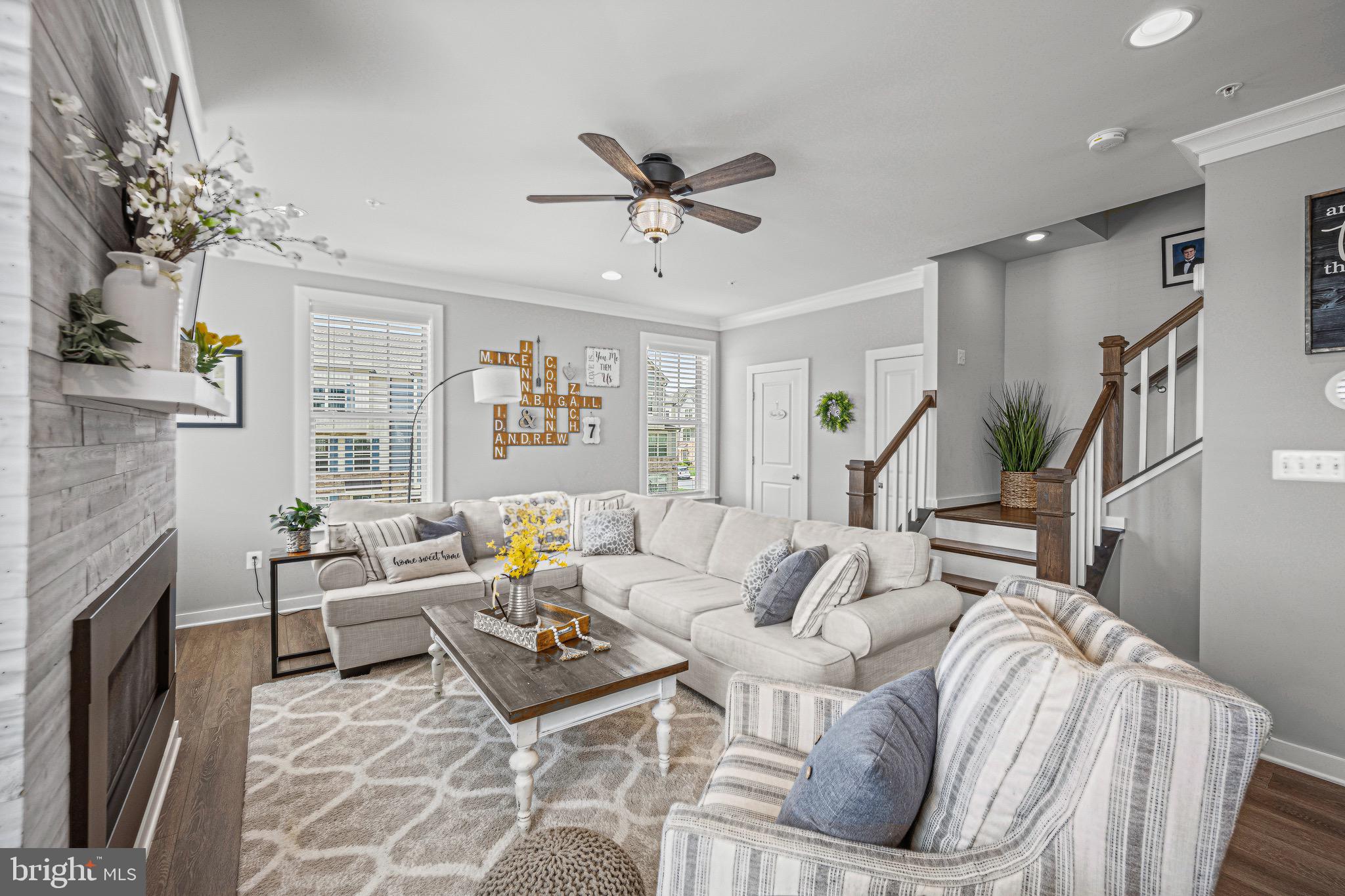 3451 Flatwoods Drive Frederick, MD 21704 - Photo 19 of 43 a living room with fireplace furniture and a chandelier