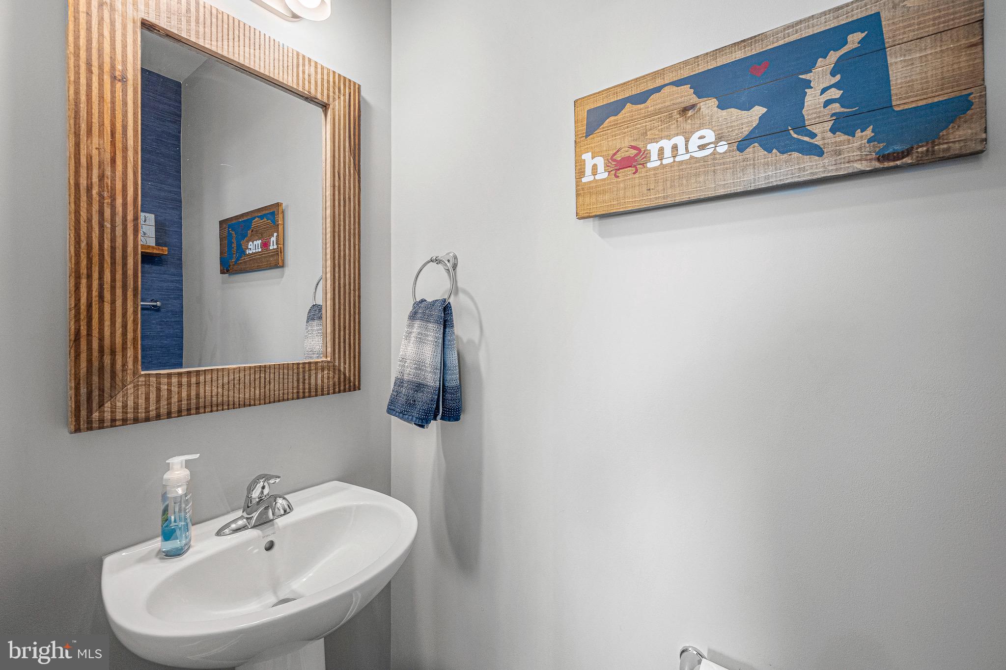 3451 Flatwoods Drive Frederick, MD 21704 - Photo 20 of 43 a bathroom with a sink and a mirror