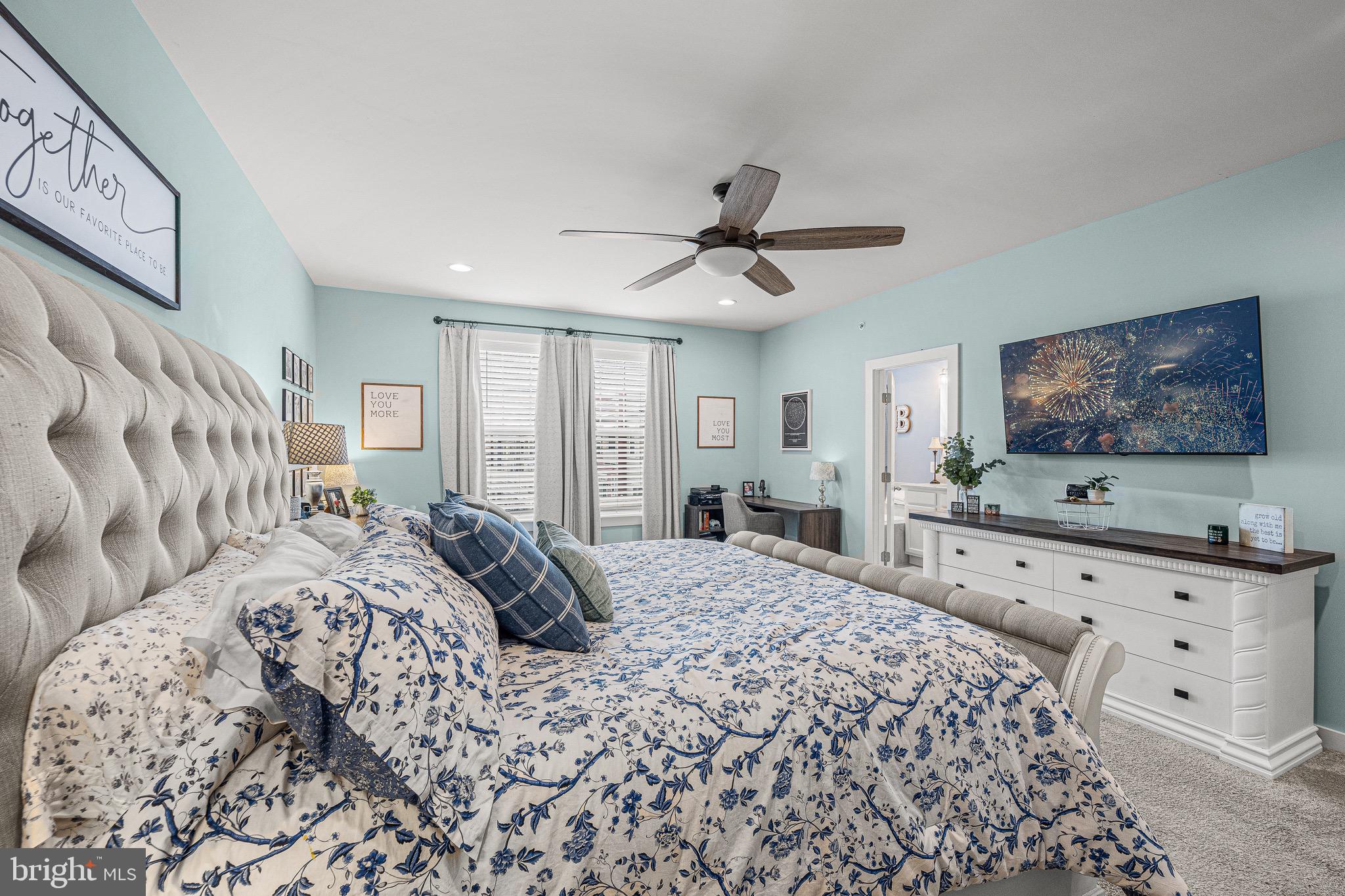 3451 Flatwoods Drive Frederick, MD 21704 - Photo 27 of 43 a spacious bedroom with a large bed and a flat screen tv