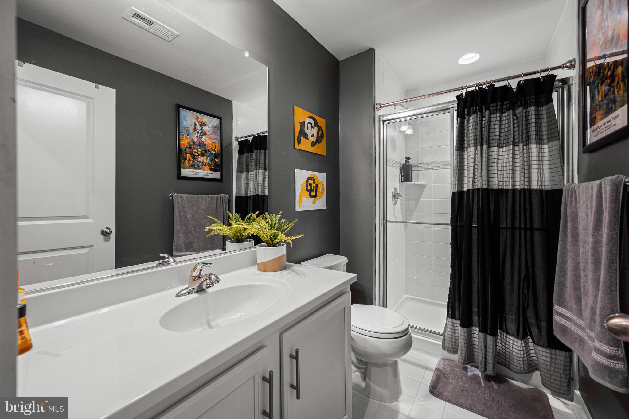 3451 Flatwoods Drive Frederick, MD 21704 - Photo 7 of 43 a bathroom with a sink toilet and shower