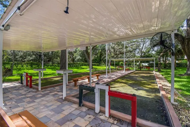 a view of a sitting area with chairs and table