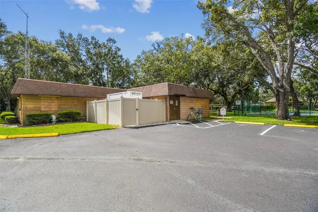 a view of a swimming pool with an outdoor space and seating area