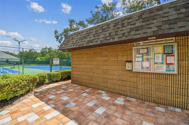 a view of a brick house with a big yard