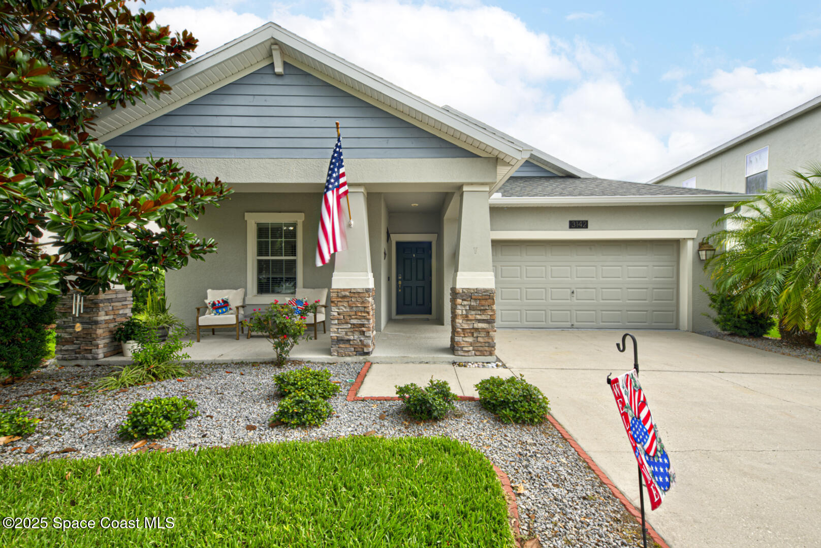 3142 Dark Sky Drive Harmony, FL 34773 - Photo 1 of 54 a front view of a house with a yard and garage