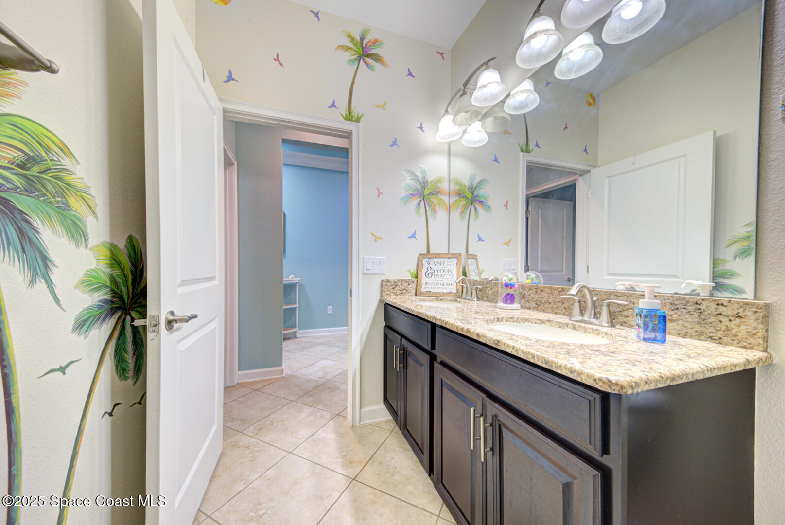 3142 Dark Sky Drive Harmony, FL 34773 - Photo 11 of 54 a bathroom with a double vanity sink and a mirror