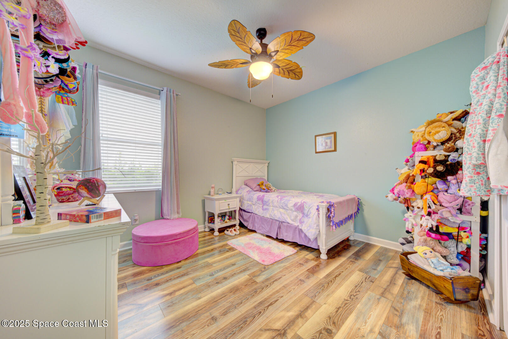 3142 Dark Sky Drive Harmony, FL 34773 - Photo 14 of 54 a bedroom with a bed and a dresser in it