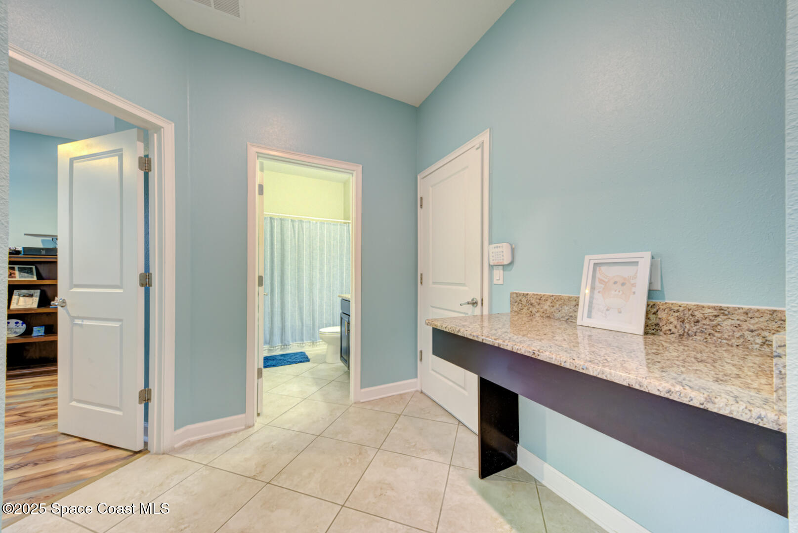 3142 Dark Sky Drive Harmony, FL 34773 - Photo 20 of 54 a bathroom with a granite countertop sink a mirror and a shower