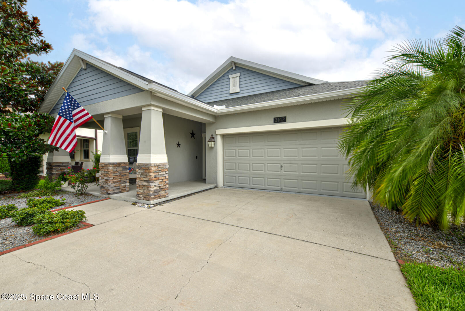 3142 Dark Sky Drive Harmony, FL 34773 - Photo 3 of 54 a front view of a house with garage and yard