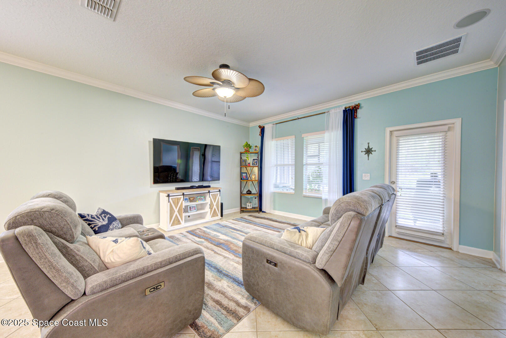 3142 Dark Sky Drive Harmony, FL 34773 - Photo 32 of 54 a living room with furniture and a flat screen tv
