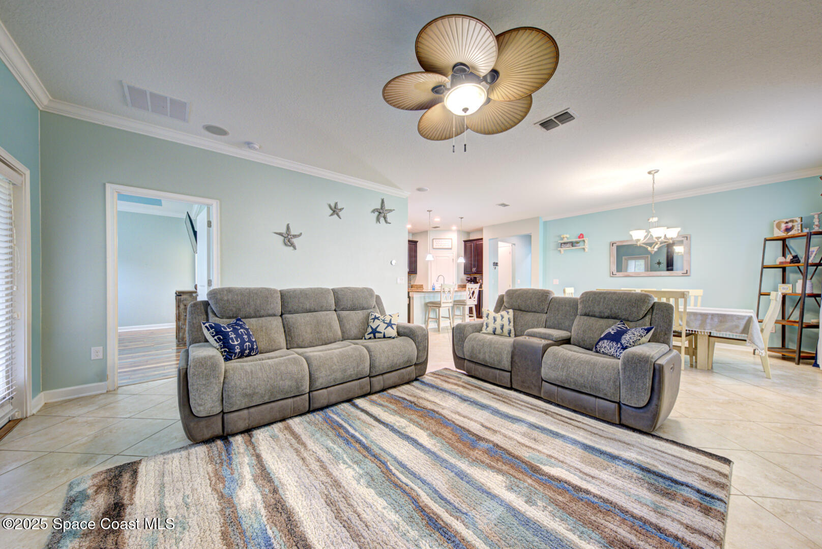 3142 Dark Sky Drive Harmony, FL 34773 - Photo 33 of 54 a living room with furniture a lamp and a rug
