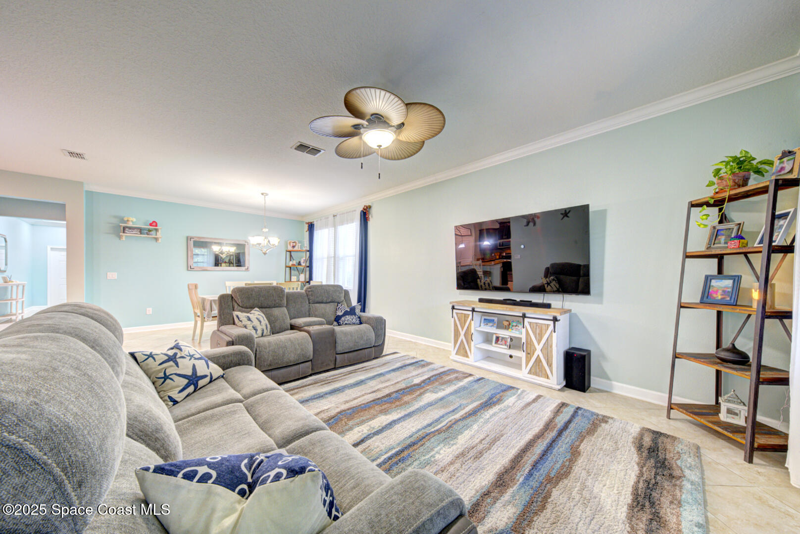 3142 Dark Sky Drive Harmony, FL 34773 - Photo 34 of 54 a living room with furniture and a flat screen tv