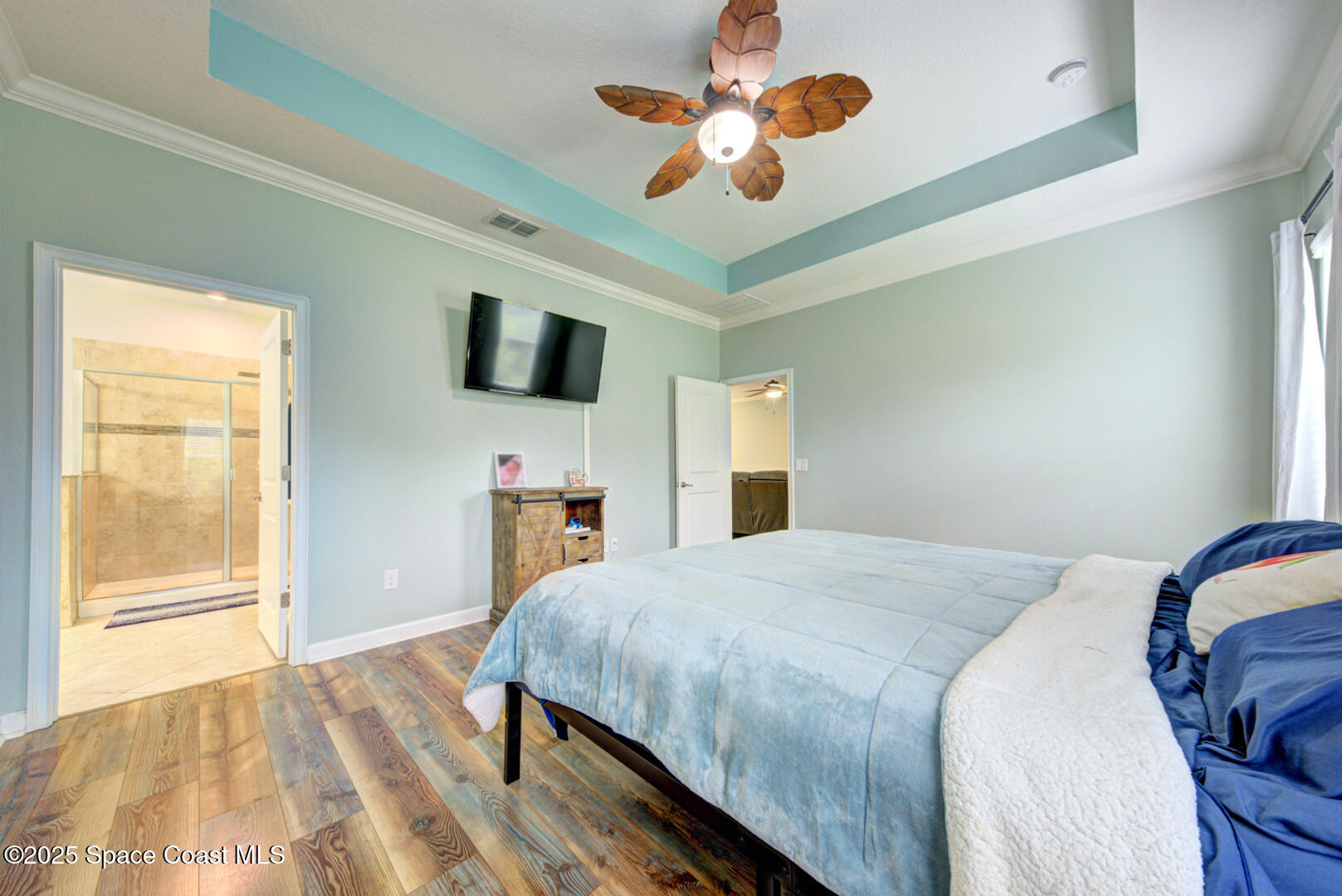 3142 Dark Sky Drive Harmony, FL 34773 - Photo 37 of 54 a bedroom with a bed ceiling fan and a large window